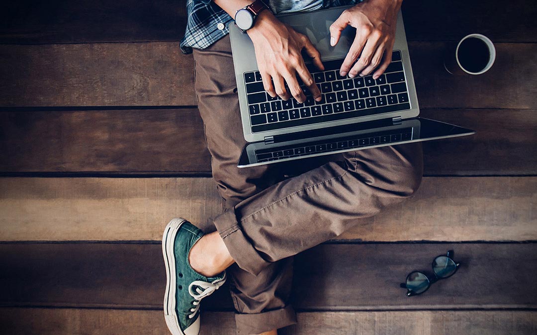 remote employee working on laptop from alternate location