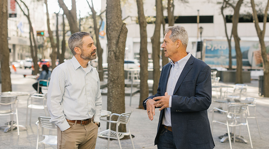 Jim Dougal speaking with  partner Todd Cannan