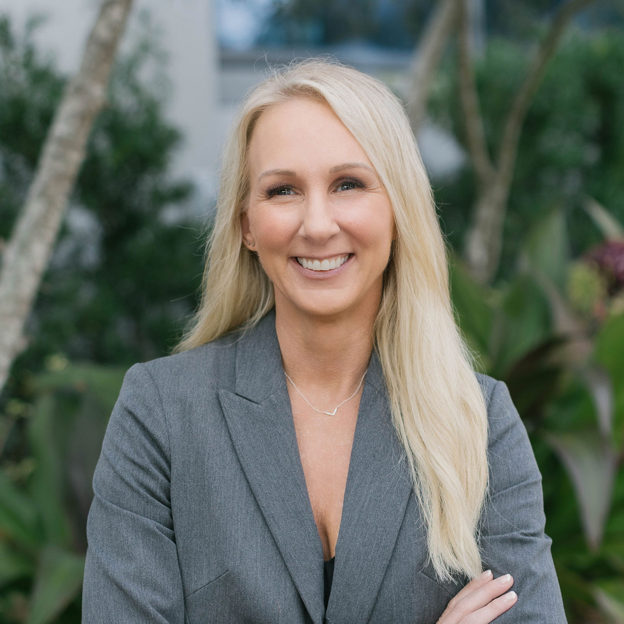 SummitET-Angela-Leek-2024-2 woman dressed in business suit smiling